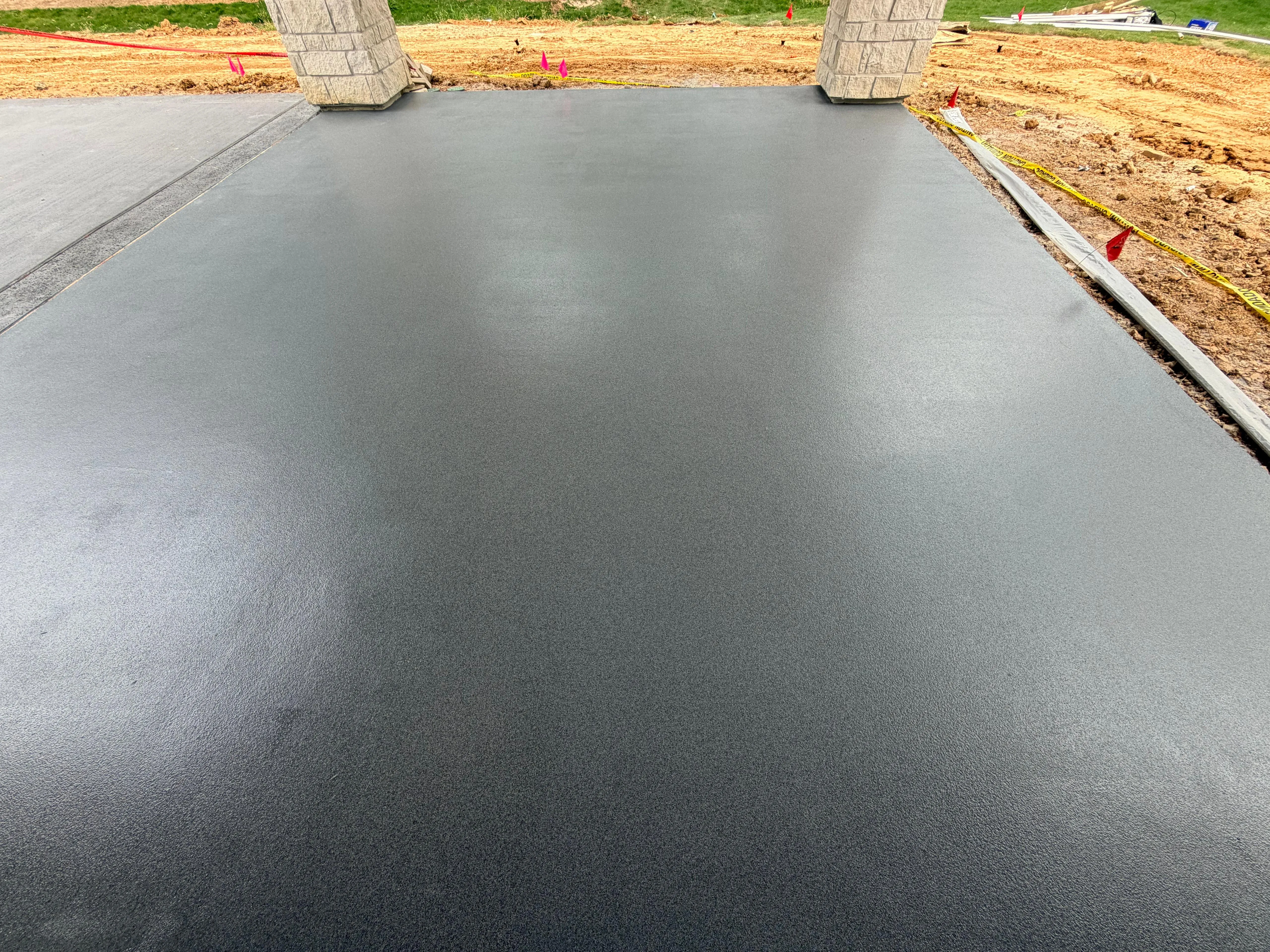 Charcoal non-slip epoxy coating on a covered exterior slab