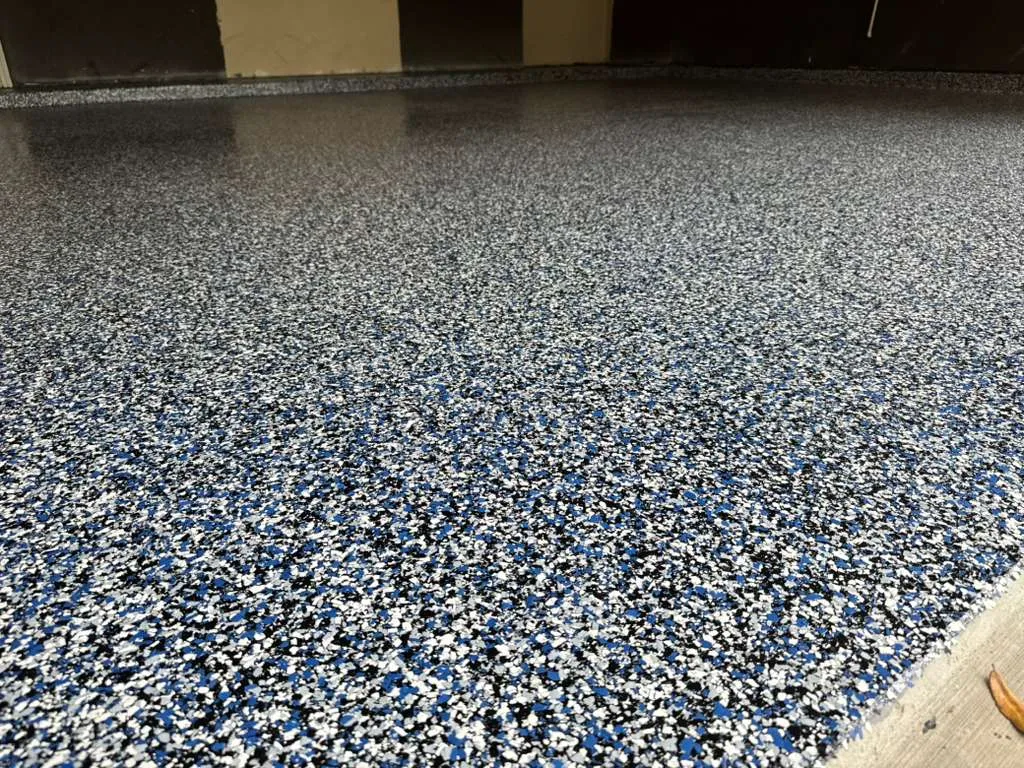 Close view of blue, white and black flake, showing the chip density up close