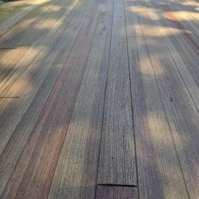 Plank-look overlay outdoors, dappled with shade from a tree