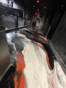 Decorative metallic style epoxy floor finish